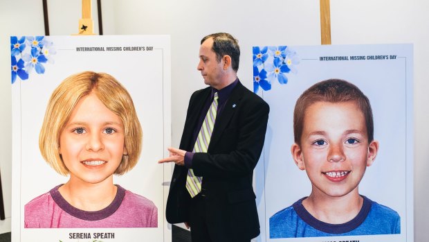 Harry Speath with aged-progessed images of his missing children, Serena and Thomas.