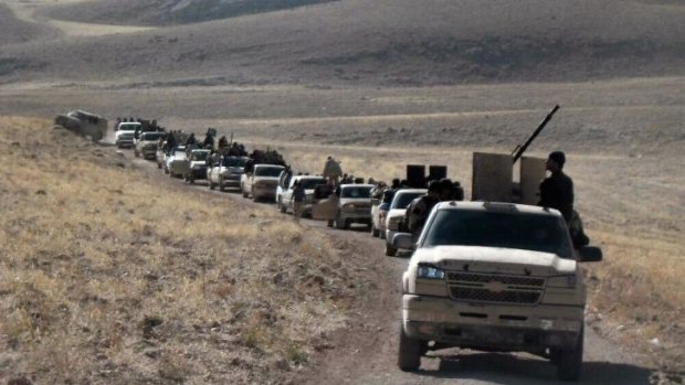 Rebel fighters pictured gathering on the Syrian side of the Qalamun hills close to the Lebanese border last week. 