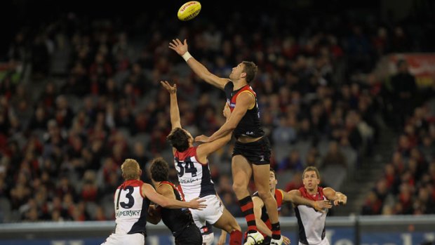 Tom Bellchambers, right, of the Bombers contests ruck against the Demons' Stefan Martin.