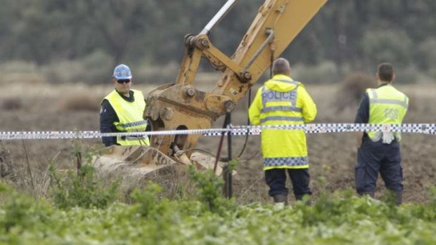 Police dig for the remains of anti-drugs campaigner Donald Mackay.