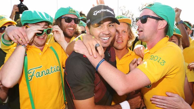 Fan favourite: Jason Day celebrates winning the World Cup of Golf at Royal Melbourne with the Fanatics in November.