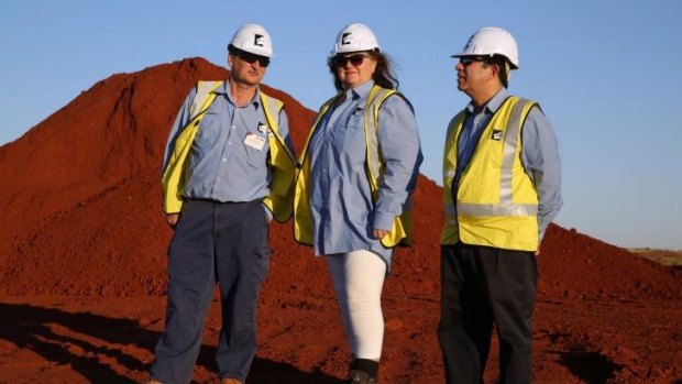 Gina Rinehart (centre) at the $10 billion Roy Hill mine pictured with Barry Fitzgerald (left), chief executive officer of the mine, and Sanjiv Manchanda, project manager. 