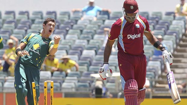 Australia's fast bowler Mitchell Starc celebrates taking the wicket of West Indies' batsman Kieron Pollard but was anybody watching at the WACA?