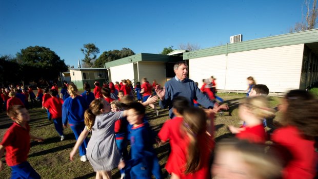 Principals of crowded inner-city schools, such as Port Melbourne Primary  School's Peter Martin, have to manage large numbers of students and a small amount of space. What gives, often, is space and time to play. 