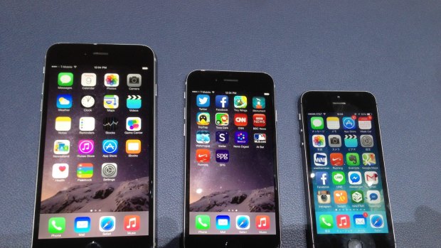 The Apple iPhone 6 Plus and 6, next to the smaller iPhone 5S.