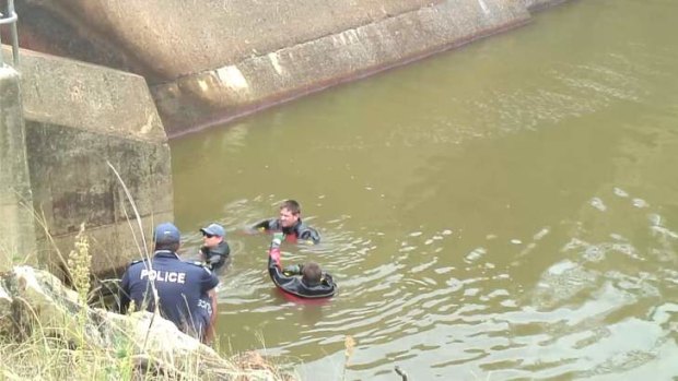 Police divers search Cedar Pocket Dam.