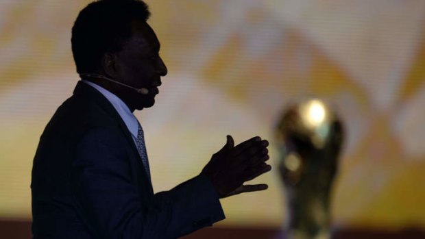Footballing legend: Brazil's Pele with the coveted World Cup trophy.