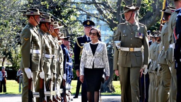 Serried ranks: Dame Marie Bashir inspects the Federation Guard. 