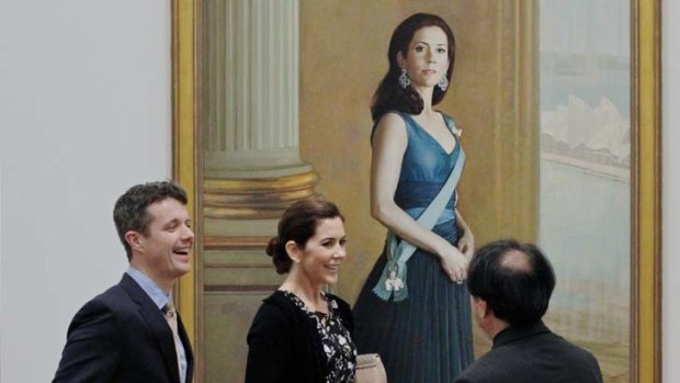 Great Danes ... the royal couple chat with the artist Jiawei Shen, who painted this portrait of Princess Mary.