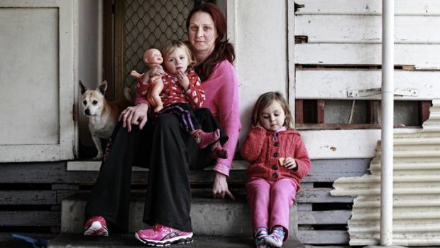 Elisha Fox, with daughters Ava and Amelie, right, and dog Tyson, pays $1300 rent a month for a vermin-infested and dangerous home in Glenroy. <a href="http://www.theage.com.au/victoria/rats-and-mice-plague-family-20120819-24gmk.html?rand=1345415152347"><strong>Read her story here </strong></a>