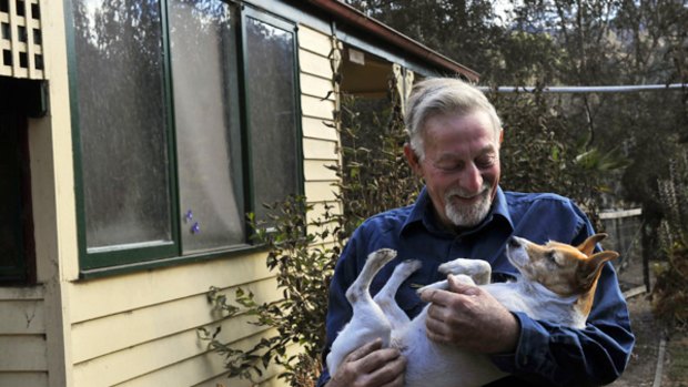 Charlie Farmer, with dog Lucy, stayed to defend his Koornalla home.