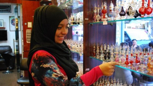 The halal perfumes are poured into intricate glass vials.