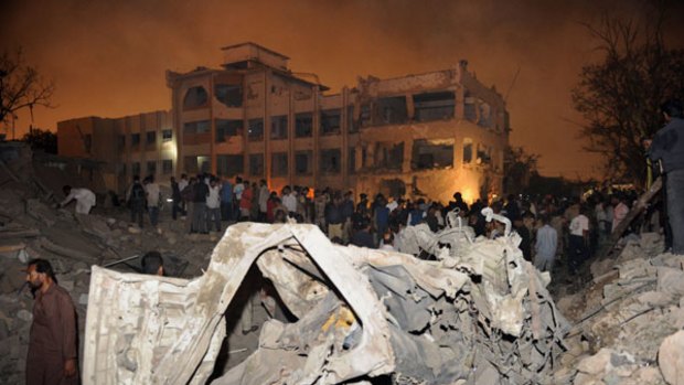 Rescue and security personnel at the site of the blast.