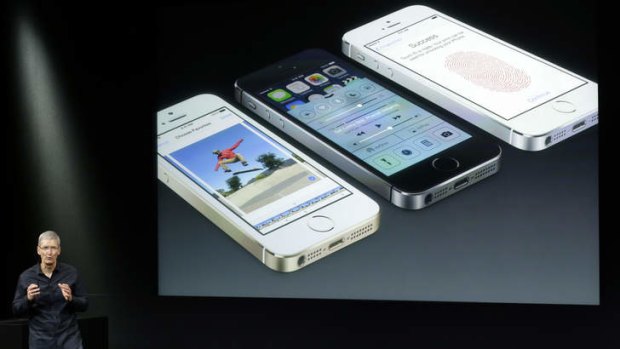 Tim Cook, CEO of Apple, speaks on stage during the introduction of the new iPhone 5s.