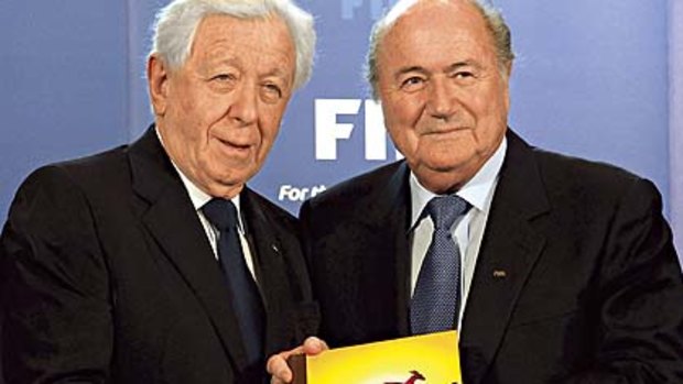 The big day ... FFA chairman Frank Lowy presents Australia's 2018-2022 World Cup bid book to FIFA president Sepp Blatter in Zurich.