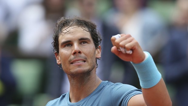 Spain's Rafael Nadal celebrates after defeating Argentina's Facundo Bagnis during their second round match of the French Open tennis tournament at the Roland Garros stadium, Thursday, May 26, 2016 in Paris.  Nadal won 6-3, 6-0, 6-3. (AP Photo/David Vincent)