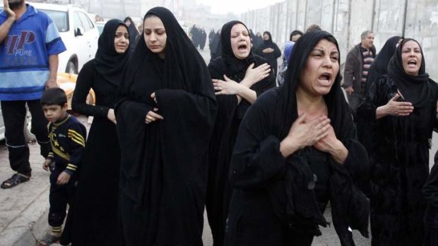 Anger and despair: Shi'ite women mourn during the funeral of a victim, who was killed in bomb attacks outside a cafe in Baghdad's Sadriya district.