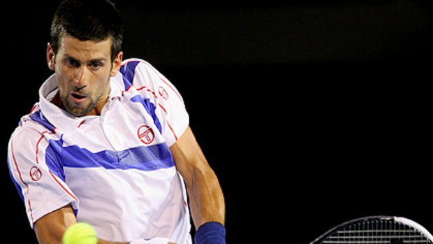 Novak Djokovic pounces on a backhand in his quarter final match at the 2011 Australian Open.