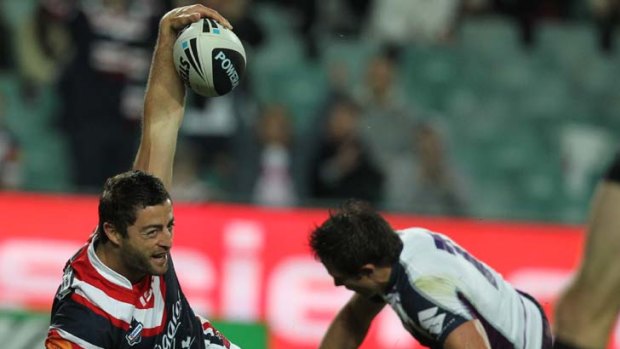 The Roosters Anthony Minichiello goes over the line to score a try.