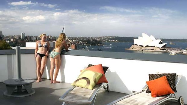 The high life ... sun and views from the Sydney Harbour YHA roof.