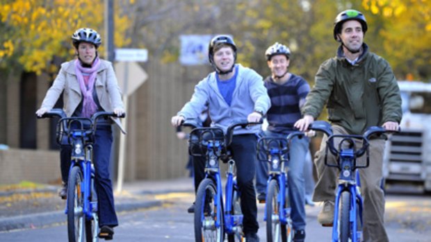 Riders take part in the first day of the Melbourne Bike Share scheme at Melbourne University.