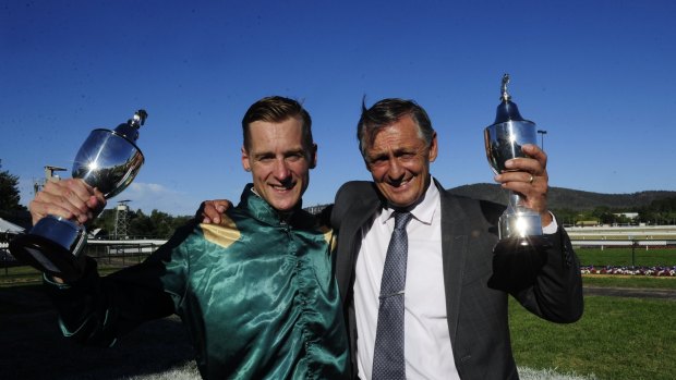 Toasting their success: Jockey Blake Shinn and trainer Peter Snowden celebrate Defcon's win in the Black Opal Stakes.