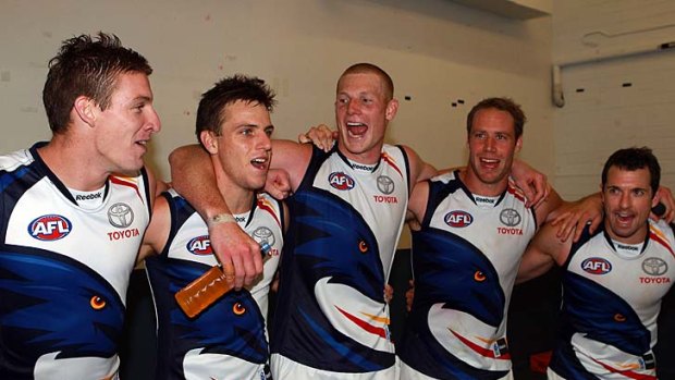 Crows celebrate their gutsy win.
