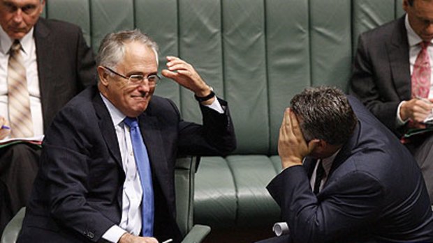 Malcolm Turnbull  and Joe Hockey share a moment during question time yesterday