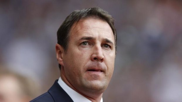 Malky Mackay looks on from the dugout during a game in 2013.