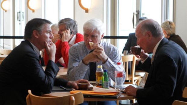 The hottest items on the political menu ... Rob Oakeshott, Bob Katter and Tony Windsor at the parliamentary cafe, with the Liberal Bill Heffernan nearby.