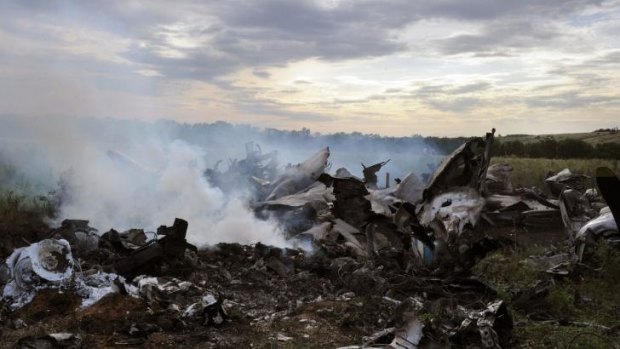 The wreckage of a Ukrainian AN-26 military transport plane after it was shot down by a missile in the village of Davydo-Mykilske, east of Luhansk near the Russian border. 