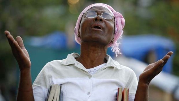 Divine help ... a woman sings at a church service in Port-au-Prince.