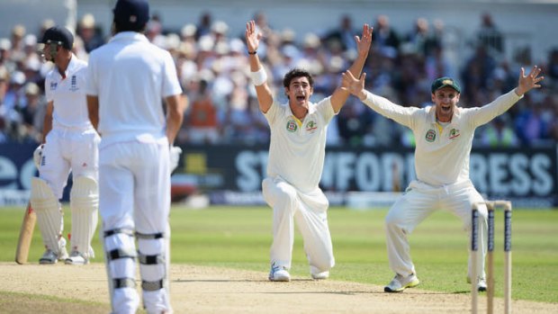 Controversial call: Mitchell Starc of Australia unsuccessfully appeals for LBW against Jonathan Trott. The decision was overturned on review.