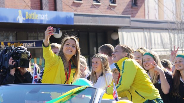 Kellie White, left, and Emily Smith were honoured with a street parade in Crookwell after the Hockeyroos won gold at the 2014 Commonwealth Games.. 