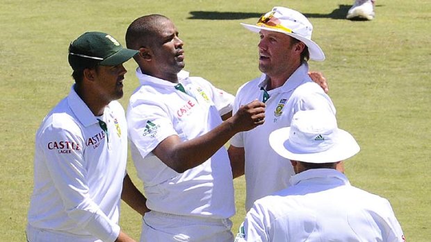 Vernon Philander celebrates with his teammates after dismissing Sri Lanka's captain Tillekaratne Dilshan as the visitors followed on after being dismissed for 239 in their first innings.