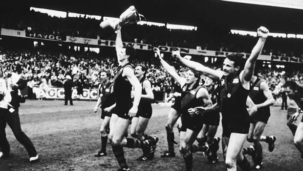 Heady days for a young Bomber. 1985 Grand Final Essendon v Hawthorn Paul Salmon holds aloft the premiership cup with his Essendon team-mates in tow.