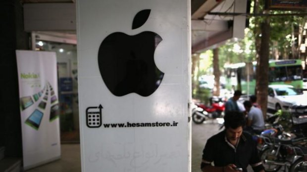 Appetite for technology: A man passes an unlicensed Apple store in Isfahan, Iran. 