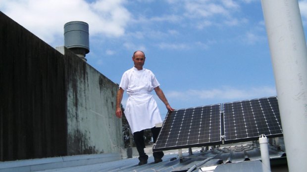 Restaurateur Philippe Pinson believes his 15 solar panels - fitted at a cost of $12,000 - should save about $200 each quarter.