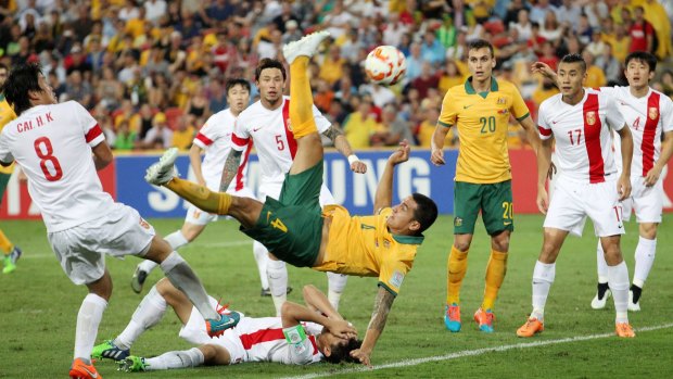 Super strike ... Australia's Tim Cahill performs a overhead kick to score the first of two goals for the Socceroos in the Asia Cup quarterfinal soccer match against China in Brisbane.