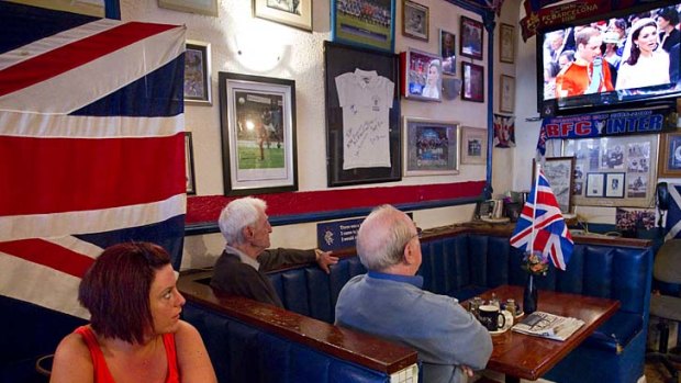Watched by billions ... British ex-pats watch the royal wedding between Prince William and Kate Middleton on TV in Benalmadena, Spain.