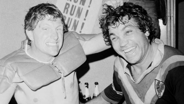 Old enemies: Ron Coote (left) and Arthur Beetson celebrate winning the grand final with Easts in 1975.