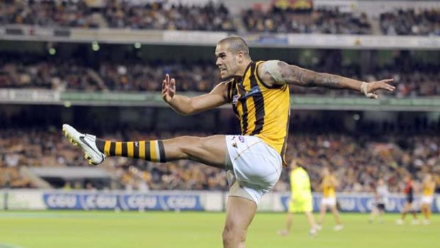 Buddy Franklin lets fly for one of his goals against Essendon.