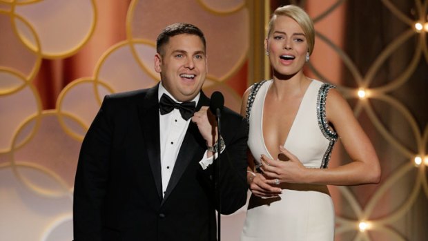 Rise to the top: Margot Robbie appears on stage with actor Jonah Hill at the Golden Globe Awards.