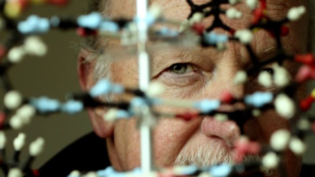 Vision through the maze ... John Shine with a double-helix model of DNA.