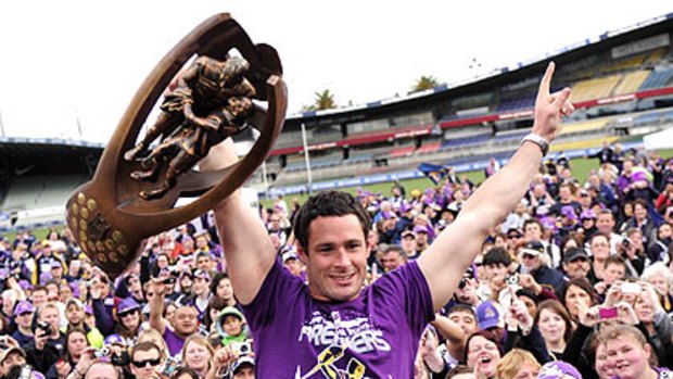 Brett White raises the 2009 NRL trophy and acknowledges the crowd at last year’s post-match celebrations at Princes Park.