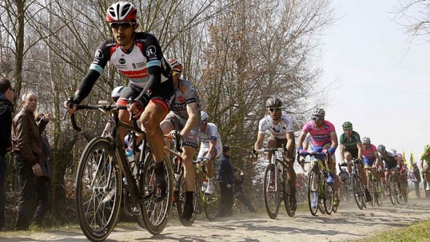 Gruelling: Switzerland's Fabian Cancellara leads the peleton through a cobble-stoned section during of the 111th Paris-Roubaix.