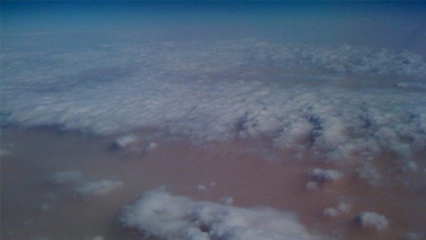 A photo of Wednesday's dust storms taken from a plane window by the comedian Arj Barker and posted on Twitter.