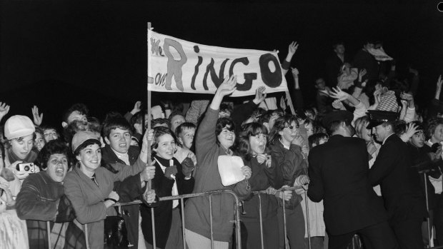 Fans await the arrival of Ringo Starr of The Beatles at Sydney Airport in June 1964.