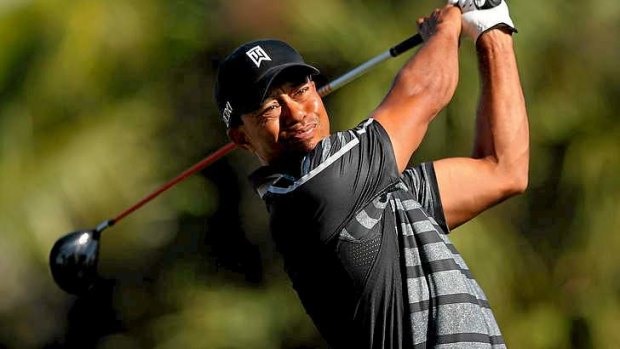 'This course had been good to me over the years' ... Tiger Woods hits his tee shot on the seventh hole.