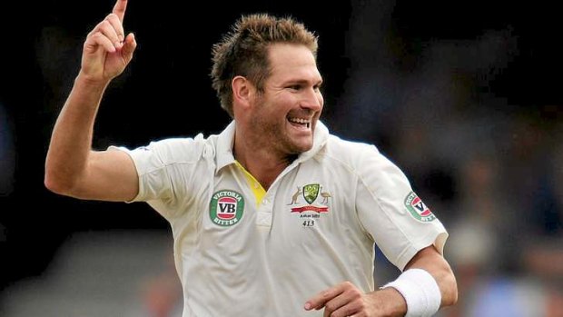 Early success: Ryan Harris celebrates taking the wicket of Alistair Cook.